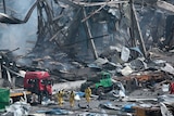 Rescue workers at site of Tianjin explosions
