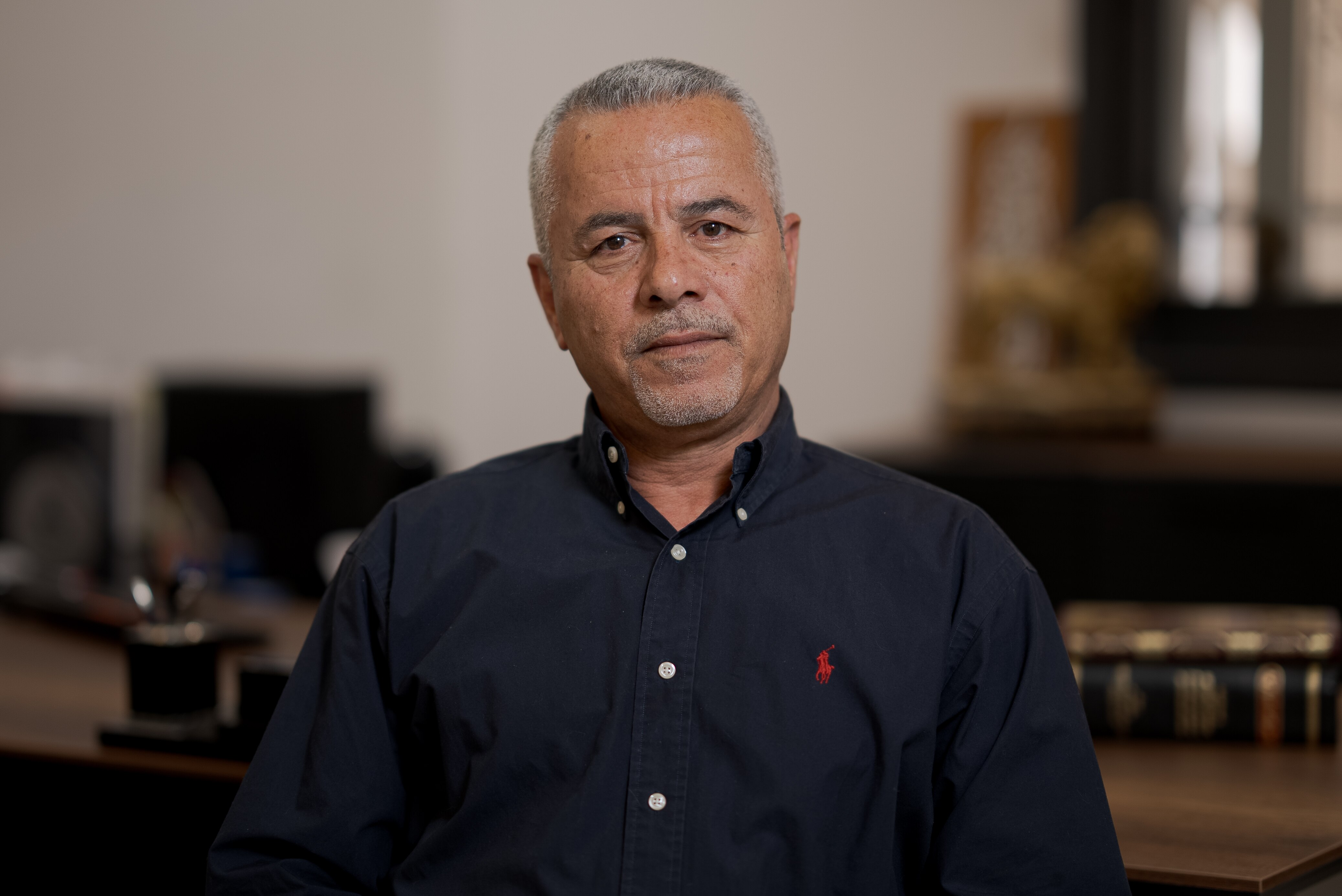 A man sitting in an office.