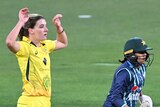 Australia bowler Annabel Sutherland puts her hands above her head after bowling in a T20 against Pakistan.