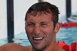 Not great reading: Ian Thorpe (right) checks his time on the scoreboard after his heat in Melbourne.