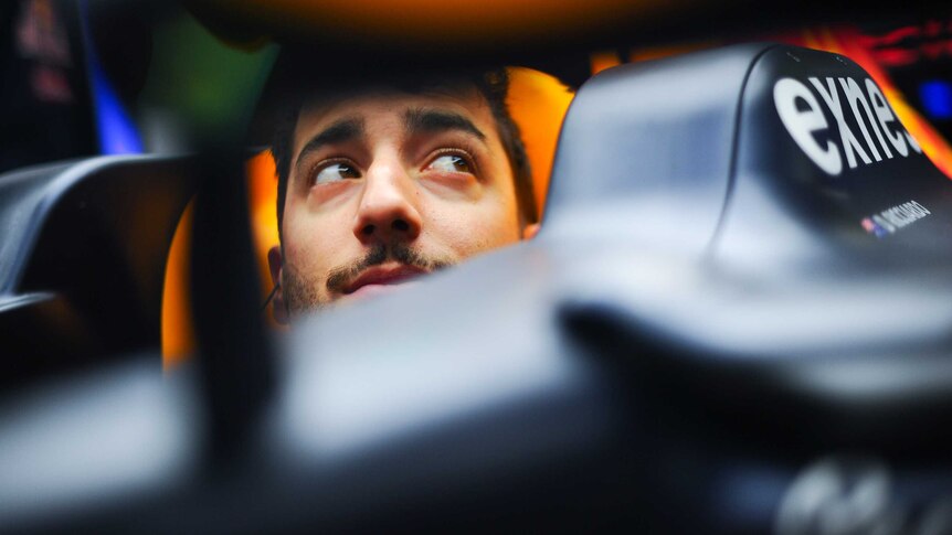 Daniel Ricciardo peeks out from his Red Bull cockpit