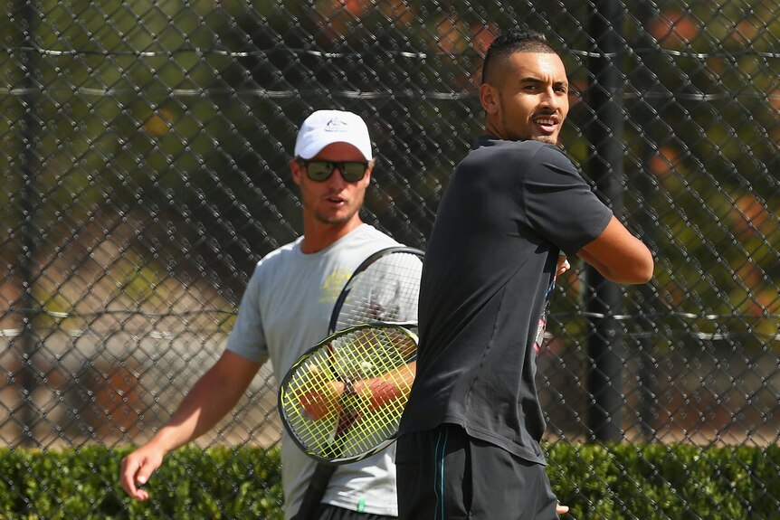 Kyrgios trains, as Hewitt watches on