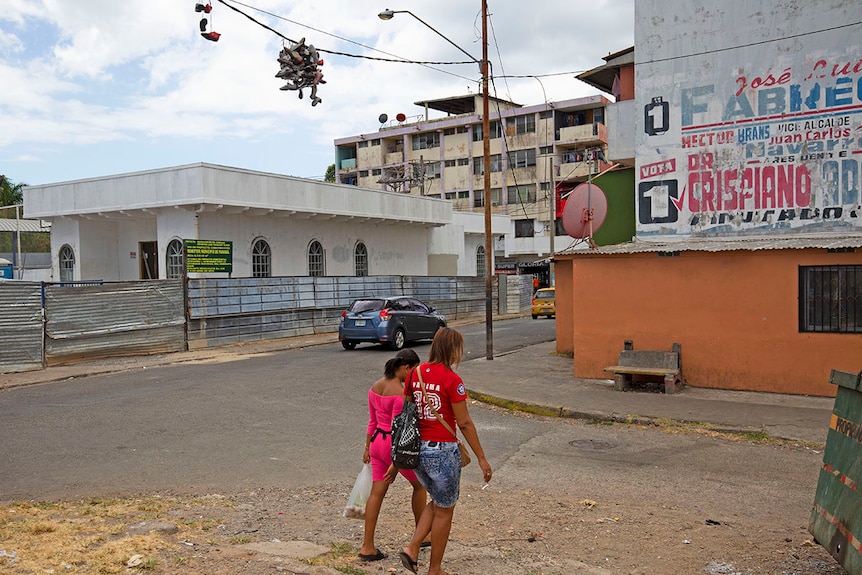 Shoes hang from powerlines in El Chorrillo.