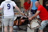 An England fan lies stricken on the ground after clashes with Russian supporters