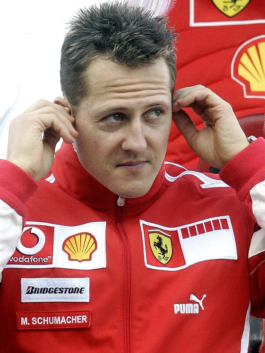 Michael Schumacher walks through the pits in February, 2006.