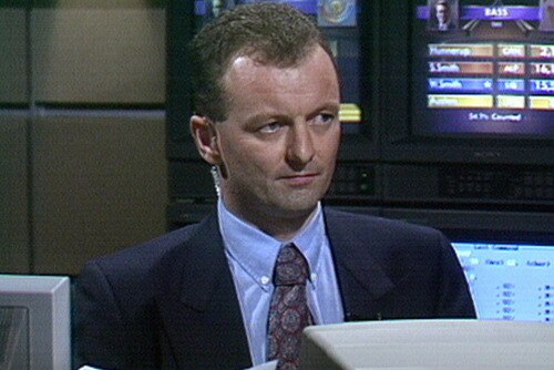 Antony Green on television in 1993, sitting in front of a desk.
