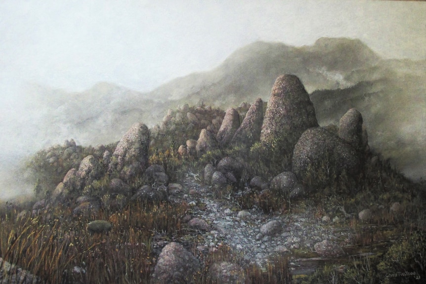 a painting of big and small boulders with a misty haze over them. 