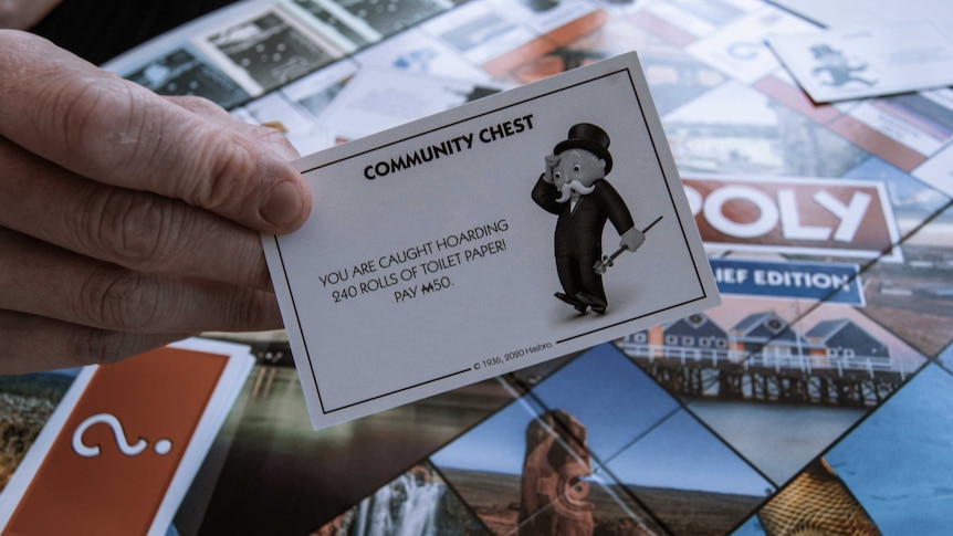 Community Chest card from Australian Monopoly Board game reading, "You are caught hoarding 240 rolls of toilet paper! Pay M50."