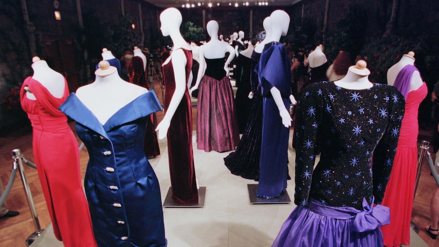 a group of dresses on mannequin on display 