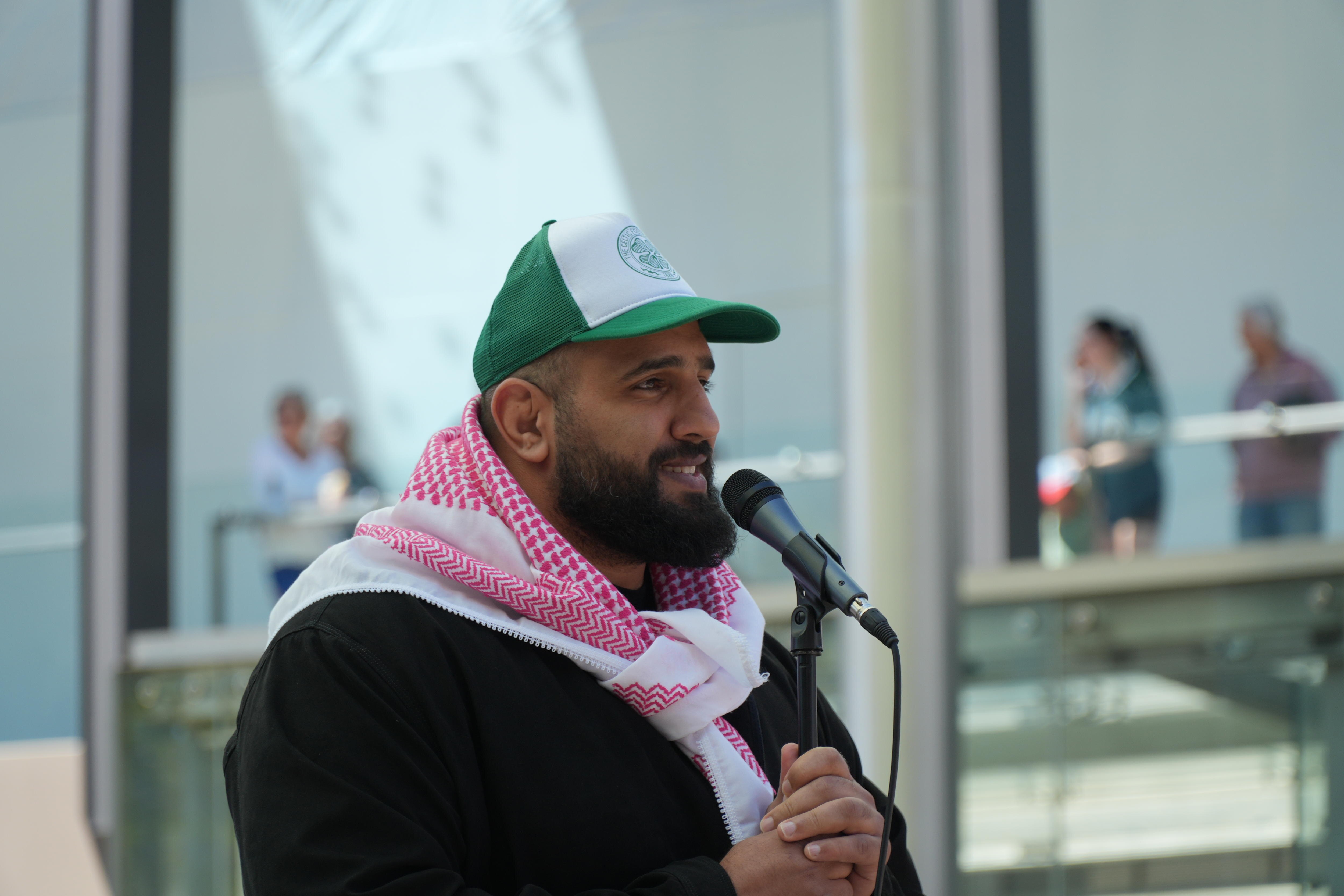 Mohammad Mustafa speaks to protesters gathered in perth for a palestinian rally