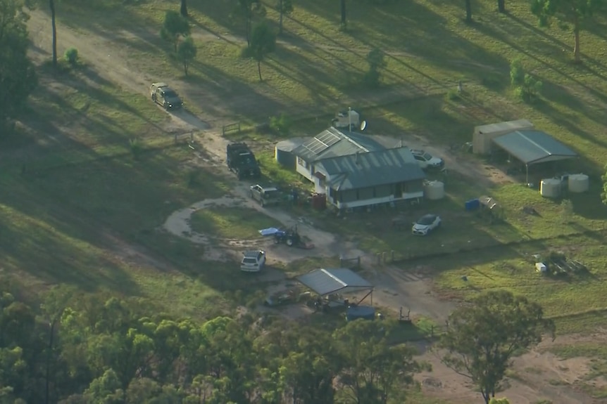 A aerial image shows a property, typical of rural Queensland, in the early morning sun