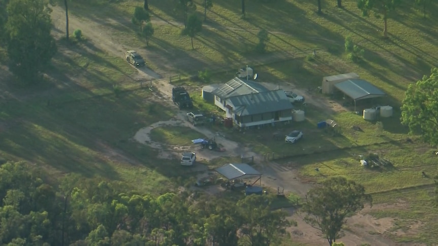 A aerial image shows a property, typical of rural Queensland, in the early morning sun