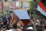 Mourners carry the coffin of Egyptian policeman Taha Ahmed Ibrahim who was killed as Israeli troops pursued militants.