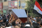 Mourners carry the coffin of Egyptian policeman Taha Ahmed Ibrahim who was killed as Israeli troops pursued militants.