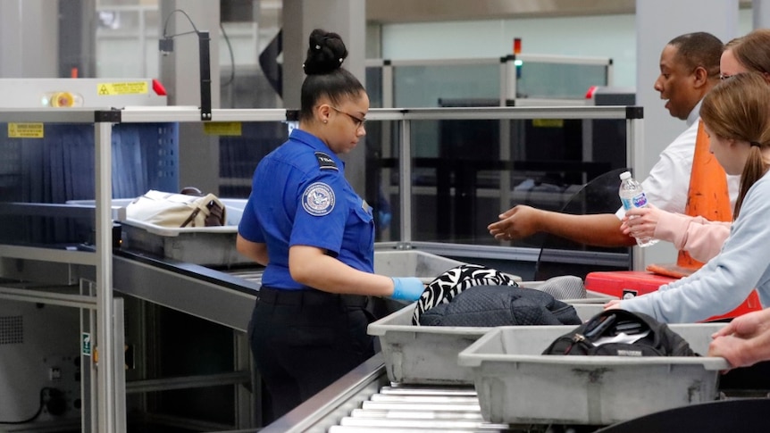 Airport security screens passengers.