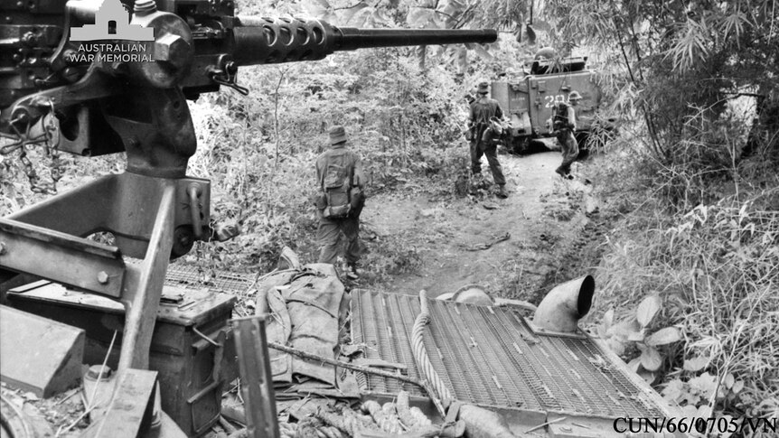 Armoured personnel carriers in pursuit of retreating Viet Cong troops