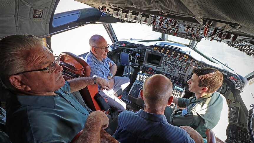 Townsville Air Force veterans inside the cock pit of the AP-3C Orion.