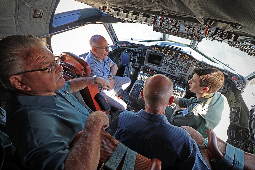 Townsville Air Force veterans inside the cock pit of the AP-3C Orion.