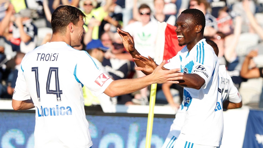 Troisi celebrates with Traore against the Mariners
