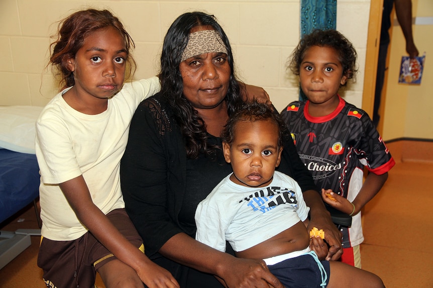 Forty-six-year-old grandmother Vanessa Wallace with her three grandchildren.