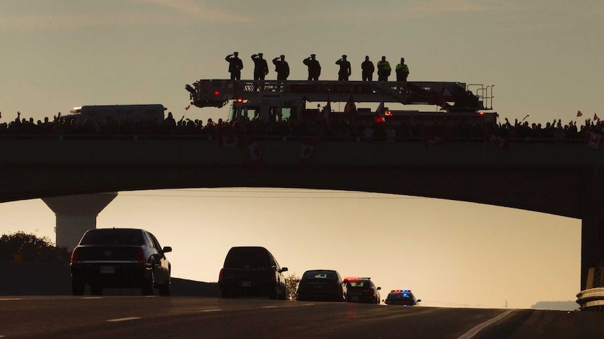 Canadians pay respects to murdered soldier along Highway of Heroes