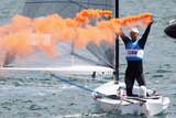 Briton Ben Ainslie celebrates gold after winning in the men's star sailing medal race