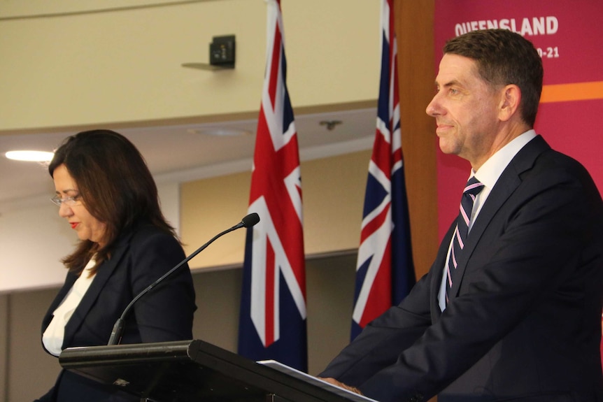 Annastacia Palaszczuk and Cameron Dick at a lectern