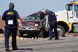 Officials inspect the crash scene