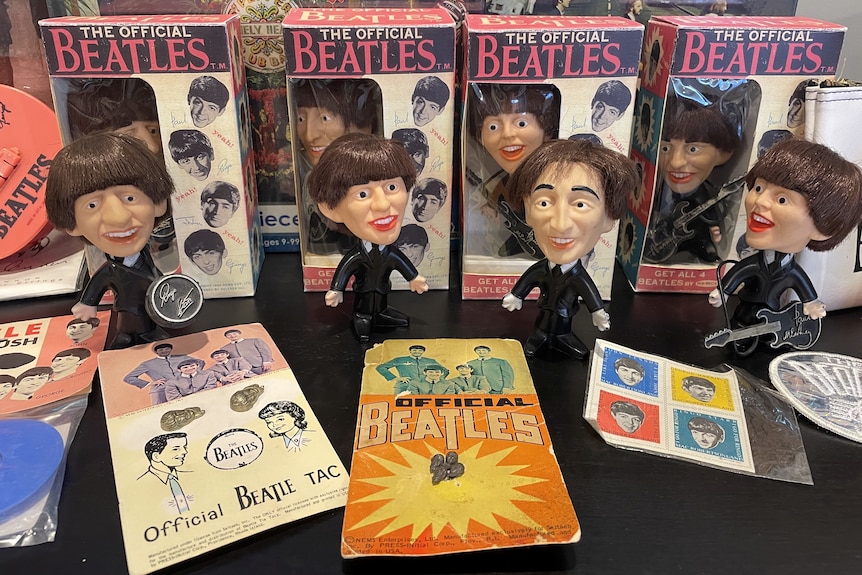 Four vintage-looking dolls of each Beatles member, still in the original packaging.