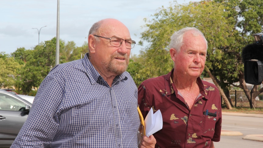 Former Bishop of Broome Christopher Saunders departs Broome Magistrate's Court alongside supporters.