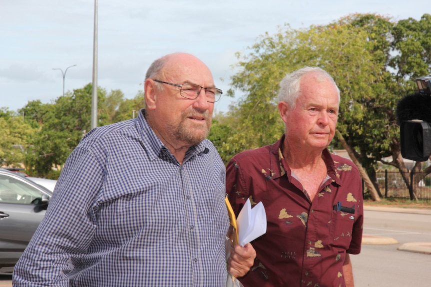 Former Bishop of Broome Christopher Saunders departs Broome Magistrate's Court alongside supporters.