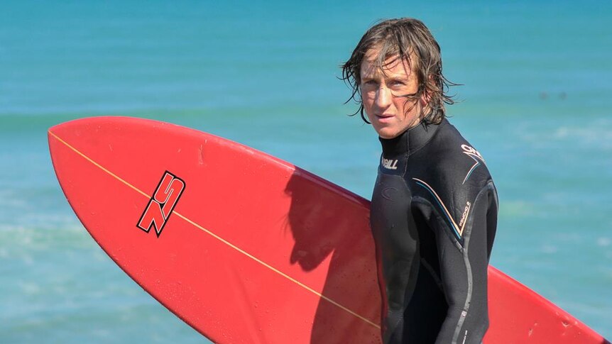 Ben Linden with surf board