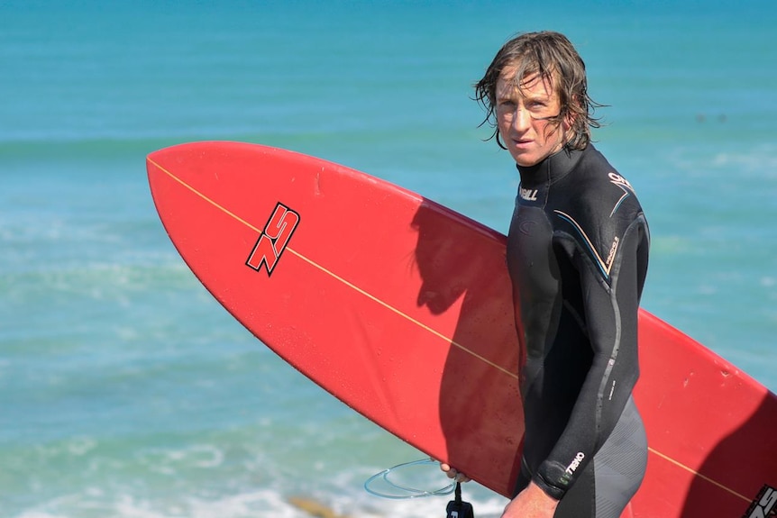 Ben Linden with surf board