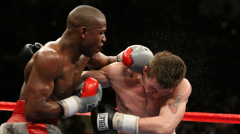 Floyd Mayweather Jr throws a left to the head of Ricky Hatton