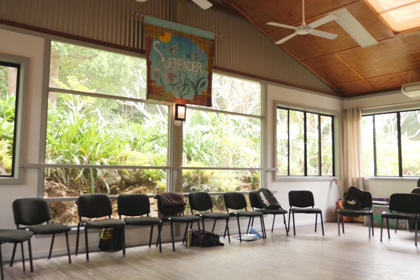 A row of empty chairs form part of a wider circle of seats used by those in recovery