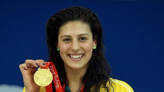 Queensland swimmer Stephanie Rice poses with one of her three Olympic gold medals in Beijing.