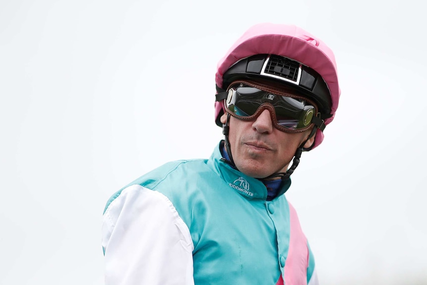 Frankie Dettori wearing jockey gear at the Qatar Prix de l'Arce de Triomphe