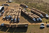 Aerial shot of all the trucks with hay