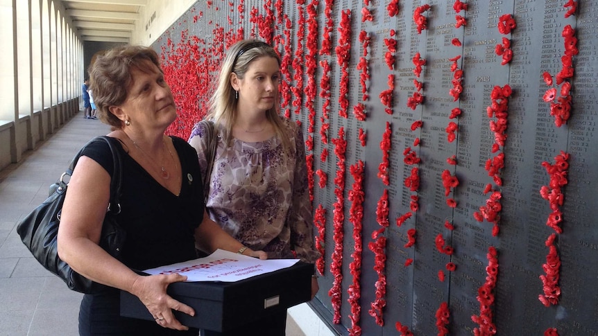 Avril Clark and Sarah McCarthy inspect the Roll of Honour.