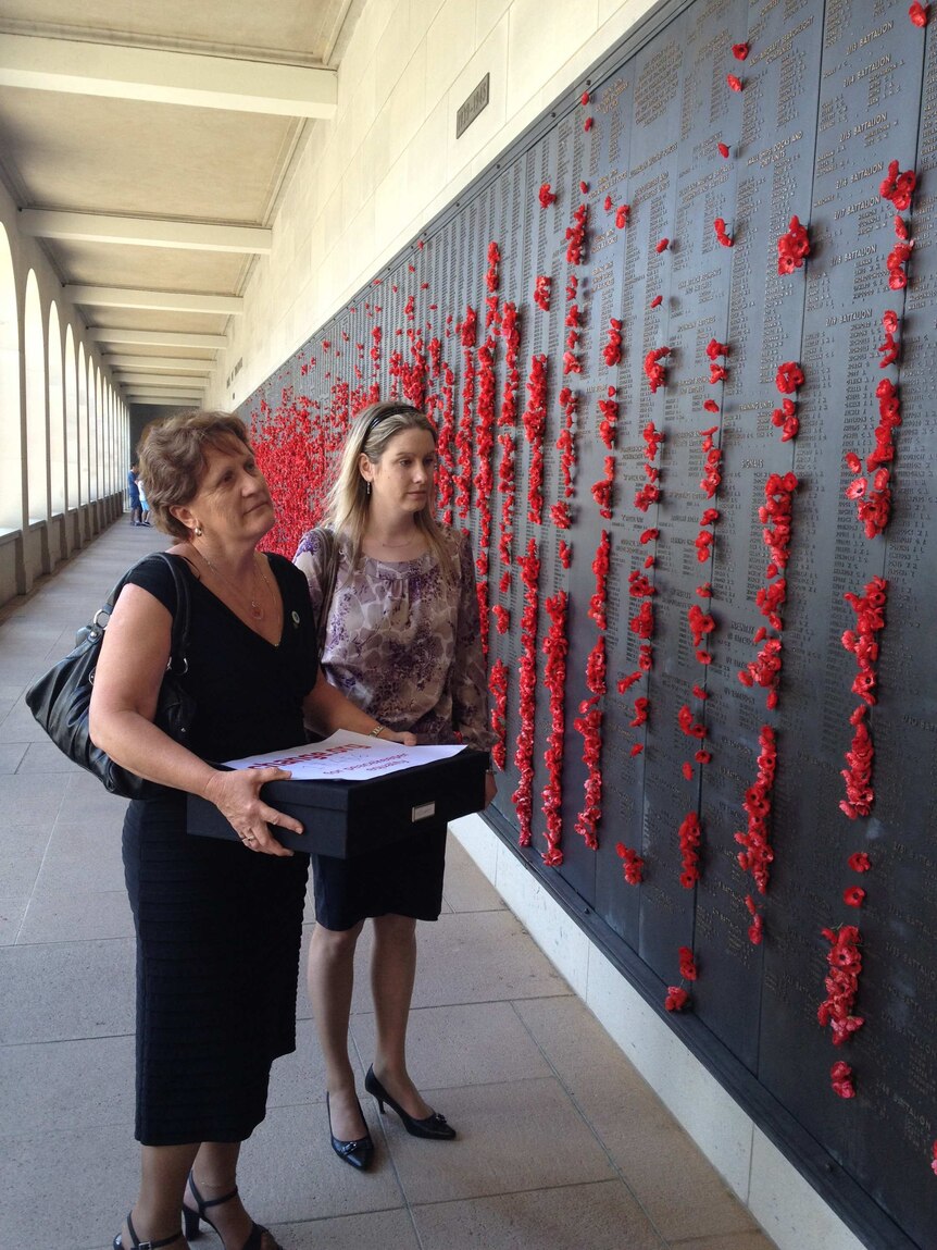 Avril Clark and Sarah McCarthy inspect the Roll of Honour.