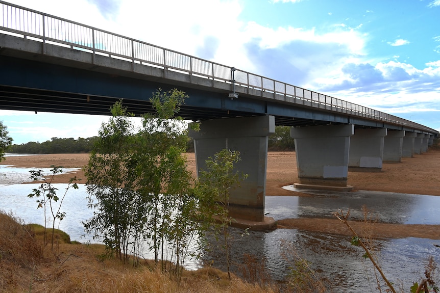 The Gascoyne River Bridge fills the frame with some creek width columns of water between two pylons.