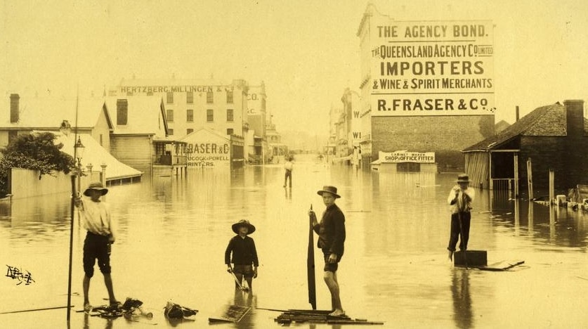 A black and white archival photo of a street in Brisbane during the 1893 floods.
