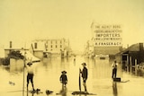 A black and white archival photo of a street in Brisbane during the 1893 floods.