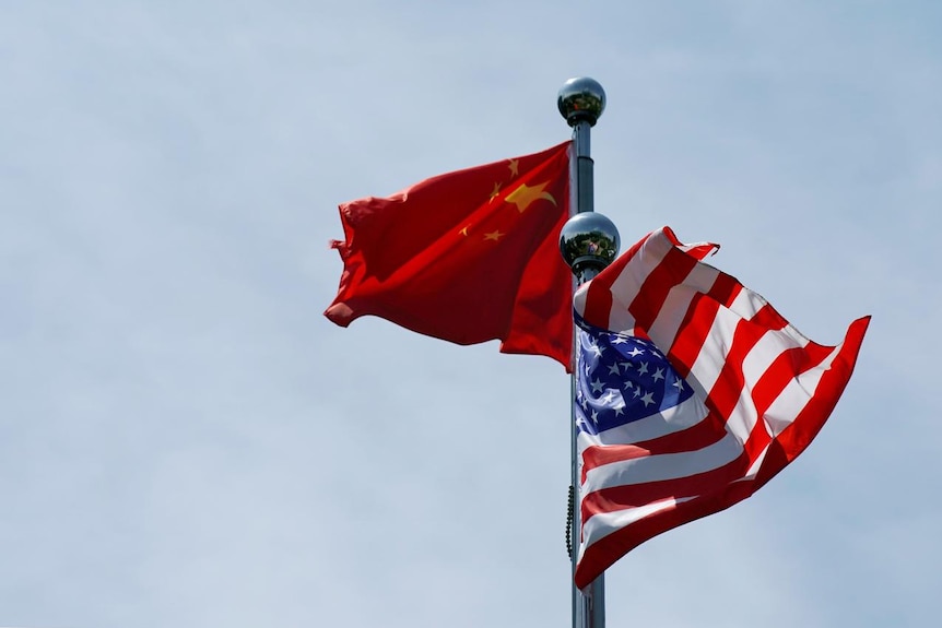 Chinese and U.S. flags flutter