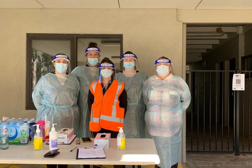 A team of COVID-19 testers in personal protective equipment