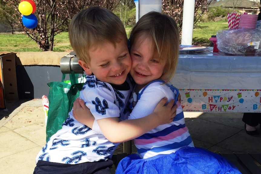 Twins Rohan and Lucy Stewart-Moore hugging