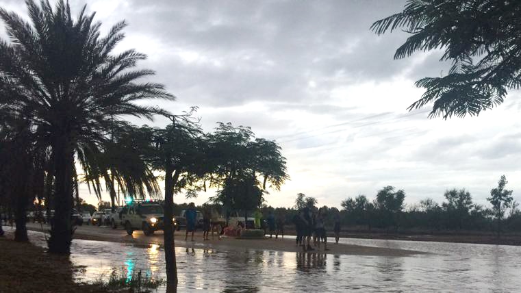 Travellers stranded by floodwaters on one of the roads near Exmouth