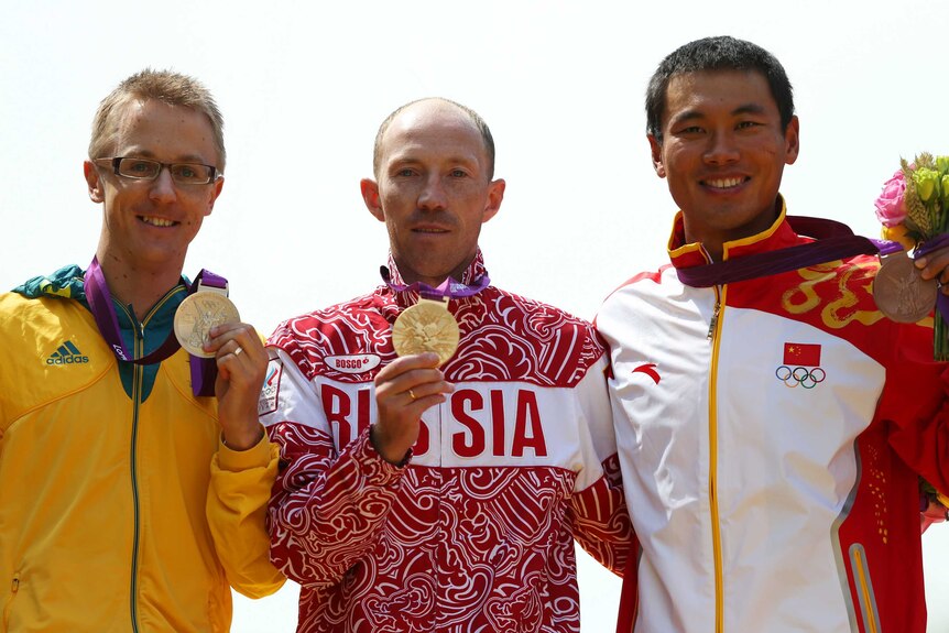 Jared Tallent (L), Russia's Sergey Kirdyapkin (C) and Tianfeng Si (R) on 50km walk London podium.