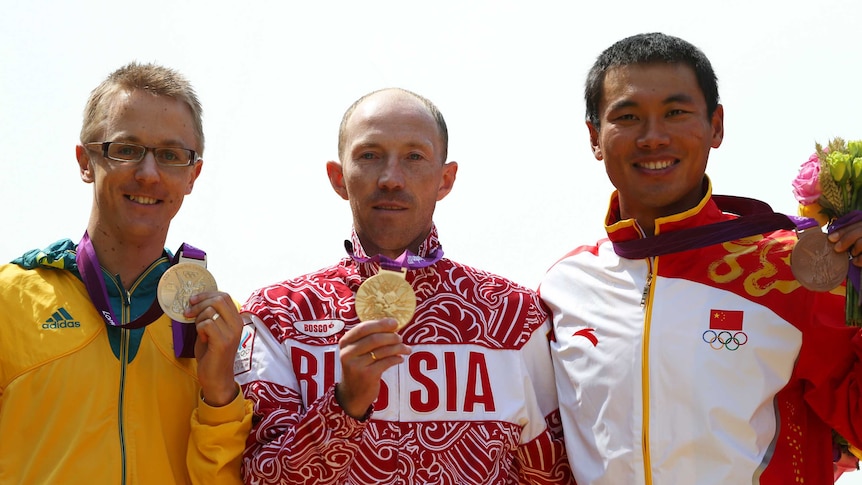 London gold ... Jared Tallent stands alongside Sergey Kirdyapkin on the medal dais at the 2012 Olympics