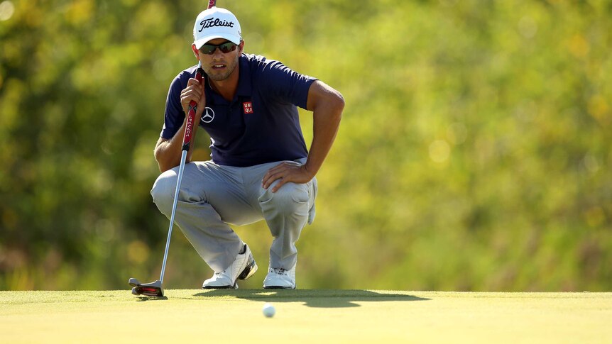 Adam Scott lines up a putt at The Barclays play-off